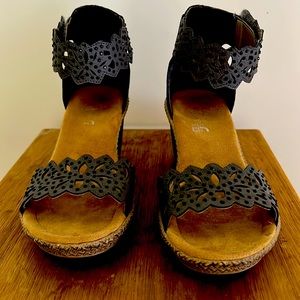 Comfy, heels with Velcro closure around ankle.